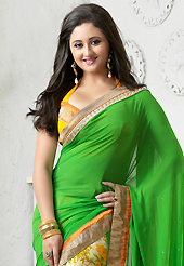 Style and trend will be at the peak of your beauty when you adorn this saree. This green, cream and yellow georgette saree is nicely designed with flower print, stone and patch bordered work. Beautiful embroidery work on saree make attractive to impress all. This saree gives you a modern and different look in fabulous style. Matching blouse is available. Slight color variations are possible due to differing screen and photograph resolution.