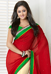 Let your personality articulate for you with this amazing printes saree. This red and cream georgette jacquard saree is nicely designed with floral, abstract print, stone and patch bordered work. Beautiful embroidery work on saree make attractive to impress all. This saree gives you a modern and different look in fabulous style. Contrasting green blouse is available. Slight color variations are possible due to differing screen and photograph resolution.