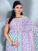 It is color this season and bright shaded suits are really something that is totally in vogue. This beautiful purple, sea green and white cotton saree is nicely designed with floral and stripe print work. It will enhance your personality and gives you a singular look. Matching blouse is available with this saree. Slight color variations are due to differing screen and photography resolution.