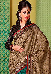 An endearing splash oh colors look gorgeous tridimensional charm. This dusty fawn and green art silk saree is nicely designed with dot, floral, foil print, self weaving zari and patch bordered work. Beautiful embroidery work on saree make attractive to impress all. This saree gives you a modern and different look in fabulous style. Contrasting black blouse is available. Slight color variations are possible due to differing screen and photograph resolution.