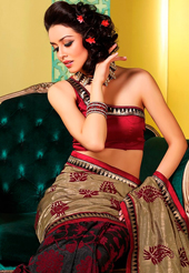Get ready to sizzle all around you by sparkling saree. This dusty fawn, black and maroon art silk saree is nicely designed with abstract print and embroidered patch work is done with resham and self weaving zari work. Beautiful embroidery work on saree make attractive to impress all. This saree gives you a modern and different look in fabulous style. Matching blouse is available. Slight color variations are possible due to differing screen and photograph resolution.