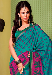 The traditional patterns used on this saree maintain the ethnic look. This turquoise and magenta art silk saree is nicely designed with floral, abstract print and lace work. Beautiful embroidery work on saree make attractive to impress all. This saree gives you a modern and different look in fabulous style. Matching blouse is available. Slight color variations are possible due to differing screen and photograph resolution.