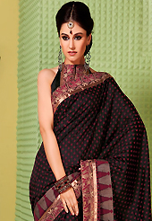 Keep the interest with this embroidered saree. This black art silk saree is nicely designed with floral, geometric print and embroidered patch work is done with resham work. Beautiful embroidery work on saree make attractive to impress all. This saree gives you a modern and different look in fabulous style. Matching blouse is available. Slight color variations are possible due to differing screen and photograph resolution.