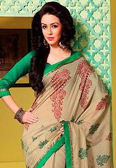 Style and trend will be at the peak of your beauty when you adorn this saree. This light fawn art silk saree is nicely designed with floral, abstract print, lace and patch work. Beautiful embroidery work on saree make attractive to impress all. This saree gives you a modern and different look in fabulous style. Contrasting green blouse is available. Slight color variations are possible due to differing screen and photograph resolution.