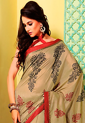 Welcome to the new era of Indian fashion wear. This fawn art silk saree is nicely designed with floral, abstract print, lace and patch work. Beautiful embroidery work on saree make attractive to impress all. This saree gives you a modern and different look in fabulous style. Contrasting red blouse is available. Slight color variations are possible due to differing screen and photograph resolution.