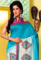 Dreamy variation on shape and forms compliment your style with tradition. This shaded blue and off white art silk saree is nicely designed with floral, abstract print and patch bordered work. Beautiful embroidery work on saree make attractive to impress all. This saree gives you a modern and different look in fabulous style. Contrasting dark burgundy blouse is available. Slight color variations are possible due to differing screen and photograph resolution.