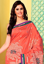 An occasion wear perfect is ready to rock you. This coral art silk saree is nicely designed with floral print, self weaving zari and patch bordered work. Beautiful embroidery work on saree make attractive to impress all. This saree gives you a modern and different look in fabulous style. Matching blouse is available. Slight color variations are possible due to differing screen and photograph resolution.