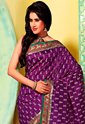 A desire that evokes a sense of belonging with a striking details. This purple art silk saree is nicely designed with floral print, self weaving zari, lace and patch bordered work. Beautiful embroidery work on saree make attractive to impress all. This saree gives you a modern and different look in fabulous style. Matching blouse is available. Slight color variations are possible due to differing screen and photograph resolution.