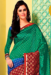 The traditional patterns used on this saree maintain the ethnic look. This green, blue and maroon art silk saree is nicely designed with floral print, self weaving zari, resham and patch bordered work. Beautiful embroidery work on saree make attractive to impress all. This saree gives you a modern and different look in fabulous style. Matching blouse is available. Slight color variations are possible due to differing screen and photograph resolution.