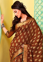 You can be sure that ethnic fashions selections of clothing are taken from the latest trend in today’s fashion. This brown art silk saree is nicely designed with floral print, self weaving zari and patch bordered work. Beautiful embroidery work on saree make attractive to impress all. This saree gives you a modern and different look in fabulous style. Matching blouse is available. Slight color variations are possible due to differing screen and photograph resolution.