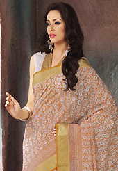 Keep the interest with this printed saree. This beautiful off white and light orange cotton saree is nicely designed with paisley, abstract print and self weaving zari work. Beautiful print work on saree make attractive to impress all. It will enhance your personality and gives you a singular look. Matching blouse is available with this saree. Slight color variations are due to differing screen and photography resolution.