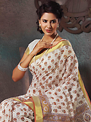 You can be sure that ethnic fashions selections of clothing are taken from the latest trend in today’s fashion. This beautiful off white and brown cotton saree is nicely designed with floral, paisley, abstract print and self weaving zari work. Beautiful print work on saree make attractive to impress all. It will enhance your personality and gives you a singular look. Matching blouse is available with this saree. Slight color variations are due to differing screen and photography resolution.