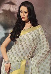 Style and trend will be at the peak of your beauty when you adorn this saree. This beautiful off white and green cotton saree is nicely designed with floral, abstract print and self weaving zari work. Beautiful print work on saree make attractive to impress all. It will enhance your personality and gives you a singular look. Matching blouse is available with this saree. Slight color variations are due to differing screen and photography resolution.