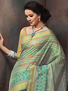 Printed sarees are the best choice for a girl to enhance her feminine look. This beautiful sea green and turquoise green cotton saree is nicely designed with stripe, floral, abstract print and self weaving zari work. Beautiful print work on saree make attractive to impress all. It will enhance your personality and gives you a singular look. Matching blouse is available with this saree. Slight color variations are due to differing screen and photography resolution.