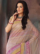 It is color this season and bright shaded suits are really something that is totally in vogue. This beautiful dark cream and pink cotton saree is nicely designed with stripe, geometric, abstract print and self weaving zari work. Beautiful print work on saree make attractive to impress all. It will enhance your personality and gives you a singular look. Matching blouse is available with this saree. Slight color variations are due to differing screen and photography resolution.