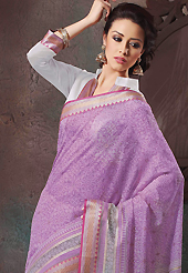Try out this year top trend, glowing, bold and natural collection. This beautiful lavender and off white cotton saree is nicely designed with floral, abstract print and self weaving zari work. Beautiful print work on saree make attractive to impress all. It will enhance your personality and gives you a singular look. Matching blouse is available with this saree. Slight color variations are due to differing screen and photography resolution.