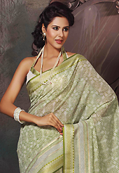 An occasion wear perfect is ready to rock you. This beautiful off white and light green cotton saree is nicely designed with abstract print and self weaving zari work. Beautiful print work on saree make attractive to impress all. It will enhance your personality and gives you a singular look. Matching blouse is available with this saree. Slight color variations are due to differing screen and photography resolution.