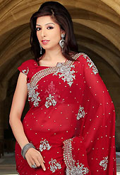 Embroidered sarees are the best choice for a girl to enhance her feminine look. This red faux chiffon saree have beautiful embroidery patch work which is embellished with stone and cutbeads work. Fabulous designed embroidery gives you an ethnic look and increasing your beauty. Matching blouse is available. Slight Color variations are possible due to differing screen and photograph resolutions.