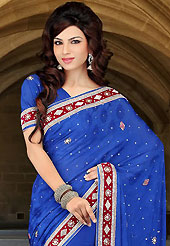 Attract all attentions with this embroidered saree. This blue faux chiffon jacquard saree have beautiful embroidery patch work which is embellished with sequins, stone, cutbeads and zardosi work. Fabulous designed embroidery gives you an ethnic look and increasing your beauty. Matching blouse is available. Slight Color variations are possible due to differing screen and photograph resolutions.