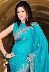 Ultimate collection of embroidered sarees with fabulous style. This light blue faux chiffon saree have beautiful embroidery patch work which is embellished with sequins, stone and cutbeads work. Fabulous designed embroidery gives you an ethnic look and increasing your beauty. Matching blouse is available. Slight Color variations are possible due to differing screen and photograph resolutions.