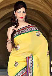 Take the fashion industry by storm in this beautiful embroidered saree. This yellow viscose saree have beautiful embroidery patch work which is embellished with resham, zari, stone and beads work. Fabulous designed embroidery gives you an ethnic look and increasing your beauty. Matching blouse is available. Slight Color variations are possible due to differing screen and photograph resolutions.