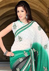 Keep the interest with this designer embroidery saree. This white, green and black faux chiffon saree have beautiful embroidery patch work which is embellished with zari, sequins, stone and zardosi work. Fabulous designed embroidery gives you an ethnic look and increasing your beauty. Matching blouse is available. Slight Color variations are possible due to differing screen and photograph resolutions.