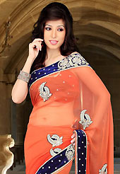 Make a trendy look with this classic embroidered saree. This orange viscose saree have beautiful embroidery patch work which is embellished with zari, sequins and stone work. Fabulous designed embroidery gives you an ethnic look and increasing your beauty. Matching blouse is available. Slight Color variations are possible due to differing screen and photograph resolutions.