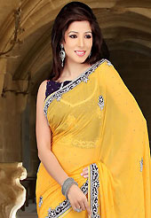 Style and trend will be at the peak of your beauty when you adorn this saree. This yellow viscose saree have beautiful embroidery patch work which is embellished with sequins and stone work. Fabulous designed embroidery gives you an ethnic look and increasing your beauty. Contrasting dark violet velvet blouse is available. Slight Color variations are possible due to differing screen and photograph resolutions.
