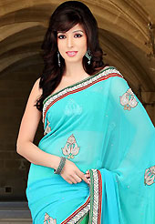 Envelope yourself in classic look with this charming saree. This shaded light blue and green viscose saree have beautiful embroidery patch work which is embellished with sequins, stone, zardosi and beads work. Fabulous designed embroidery gives you an ethnic look and increasing your beauty. Matching blouse is available. Slight Color variations are possible due to differing screen and photograph resolutions.