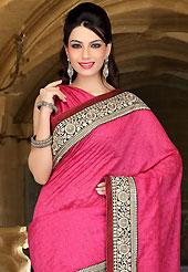 An endearing splash oh colors look gorgeous tridimensional charm. This dark pink art silk saree have beautiful embroidery patch work which is embellished with zari, sequins and stone work. Fabulous designed embroidery gives you an ethnic look and increasing your beauty. Matching blouse is available. Slight Color variations are possible due to differing screen and photograph resolutions.