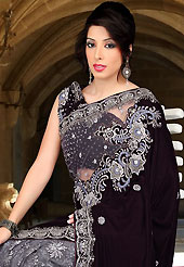Embroidered sarees are the best choice for a girl to enhance her feminine look. This deep burgundy and grey net and vevet saree have beautiful embroidery patch work which is embellished with resham, sequins, stone and cutbeads work. Fabulous designed embroidery gives you an ethnic look and increasing your beauty. Matching blouse is available. Slight Color variations are possible due to differing screen and photograph resolutions.
