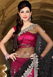 Ultimate collection of embroidered sarees with fabulous style. This black and dark pink net lehenga style saree have beautiful embroidery patch work which is embellished with sequins, stone and cutbeads work. Fabulous designed embroidery gives you an ethnic look and increasing your beauty. Matching blouse is available. Slight Color variations are possible due to differing screen and photograph resolutions.