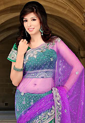 The traditional patterns used on this saree maintain the ethnic look. This magenta and green net and velvet lehenga styele saree have beautiful embroidery patch work which is embellished with resham, stone and cutbeads work. Fabulous designed embroidery gives you an ethnic look and increasing your beauty. Matching blouse is available. Slight Color variations are possible due to differing screen and photograph resolutions.