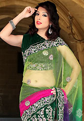 Welcome to the new era of Indian fashion wear. This shaded green, pink and purple net and velvet lehenga style saree have beautiful embroidery patch work which is embellished with zari, stone, applique, cutdana and cutbeads work. Fabulous designed embroidery gives you an ethnic look and increasing your beauty. Matching dark green velvet blouse is available. Slight Color variations are possible due to differing screen and photograph resolutions.