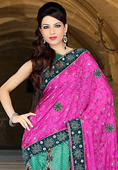 Envelope yourself in classic look with this charming saree. This magenta and turquoise green art silk and net lehenga style saree have beautiful embroidery patch work which is embellished with zari, sequins, stone, cutdana and cutbeads work. Fabulous designed embroidery gives you an ethnic look and increasing your beauty. Matching blouse is available. Slight Color variations are possible due to differing screen and photograph resolutions.