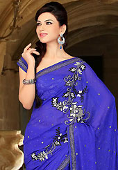 An endearing splash oh colors look gorgeous tridimensional charm. This royal blue satin chiffon saree have beautiful embroidery patch work which is embellished with reham, sequins, stone and cutbeads work. Fabulous designed embroidery gives you an ethnic look and increasing your beauty. Matching blouse is available. Slight Color variations are possible due to differing screen and photograph resolutions.