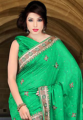 Emblem of fashion and beauty, each piece of our range of embroidered saree is certain to enhance your look as per today’s trends. This green art silk saree have beautiful embroidery patch work which is embellished with zari, sequins and stone work. Fabulous designed embroidery gives you an ethnic look and increasing your beauty. Matching blouse is available. Slight Color variations are possible due to differing screen and photograph resolutions.