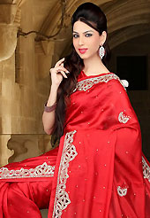 The traditional patterns used on this saree maintain the ethnic look. This red dupion silk saree have beautiful embroidery patch work which is embellished with sequins, stone and cutwork. Fabulous designed embroidery gives you an ethnic look and increasing your beauty. Matching blouse is available. Slight Color variations are possible due to differing screen and photograph resolutions.