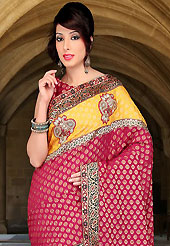 An endearing splash oh colors look gorgeous tridimensional charm. This carrot red and yellow viscose and art silk saree have beautiful embroidery patch work which is embellished with resham, sequins and stone work. Fabulous designed embroidery gives you an ethnic look and increasing your beauty. Matching blouse is available. Slight Color variations are possible due to differing screen and photograph resolutions.