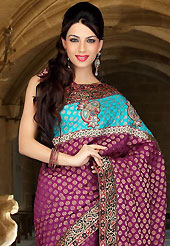 The evolution of style species collection spells pure femininity. This deep magenta and aqua blue viscose and art silk saree have beautiful embroidery patch work which is embellished with resham, sequins and stone work. Fabulous designed embroidery gives you an ethnic look and increasing your beauty. Matching blouse is available. Slight Color variations are possible due to differing screen and photograph resolutions.