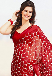 The traditional patterns used on this saree maintain the ethnic look. This beautiful red and off white faux chiffon saree is nicely designed with abstract, floral print work. Beautiful print work on saree make attractive to impress all. It will enhance your personality and gives you a singular look. Matching blouse is available with this saree. Slight color variations are due to differing screen and photography resolution.