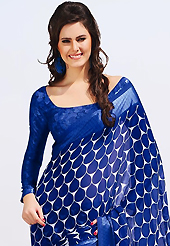Keep the interest with this printed saree. This beautiful blue and off white faux chiffon saree is nicely designed with abstract, floral print work. Beautiful print work on saree make attractive to impress all. It will enhance your personality and gives you a singular look. Matching blouse is available with this saree. Slight color variations are due to differing screen and photography resolution.