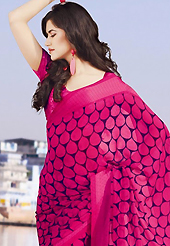 Make a trendy look with this classic printed saree. This beautiful dark pink and dark blue faux chiffon saree is nicely designed with abstract and floral print work. Beautiful print work on saree make attractive to impress all. It will enhance your personality and gives you a singular look. Matching blouse is available with this saree. Slight color variations are due to differing screen and photography resolution.