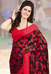 Style and trend will be at the peak of your beauty when you adorn this saree. This beautiful black and red brasso faux georgette saree is nicely designed with abstract, floral and stripe print work. Beautiful print work on saree make attractive to impress all. It will enhance your personality and gives you a singular look. Matching blouse is available with this saree. Slight color variations are due to differing screen and photography resolution.