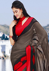 Era with extension in fashion, style, Grace and elegance have developed grand love affair with this ethnical wear. This beautiful light brown, red and black brasso faux georgette saree is nicely designed with geometric print work. Beautiful print work on saree make attractive to impress all. It will enhance your personality and gives you a singular look. Matching blouse is available with this saree. Slight color variations are due to differing screen and photography resolution.