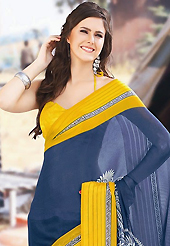 Keep the interest with this printed saree. This beautiful grey and yellow faux georgette saree is nicely designed with floral and abstract print work. Beautiful print work on saree make attractive to impress all. It will enhance your personality and gives you a singular look. Matching blouse is available with this saree. Slight color variations are due to differing screen and photography resolution.