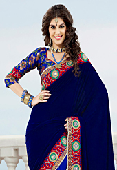 Embroidered sarees are the best choice for a girl to enhance her feminine look. This navy blue and royal blue velvet and net saree have beautiful embroidery patch work which is embellished with resham, zari and stone work. Fabulous designed embroidery gives you an ethnic look and increasing your beauty. Matching blue blouse is available. Slight Color variations are possible due to differing screen and photograph resolutions.