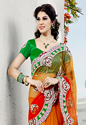 This season dazzle and shine in pure colors. This shaded orange net saree have beautiful embroidery patch work which is embellished with resham, stone and beads work. Fabulous designed embroidery gives you an ethnic look and increasing your beauty. Contrasting green blouse is available. Slight Color variations are possible due to differing screen and photograph resolutions.