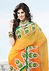 Ultimate collection of embroidered sarees with fabulous style. This yellow and shaded orange viscose georgette saree have beautiful embroidery patch work which is embellished with resham, stone and beads work. Fabulous designed embroidery gives you an ethnic look and increasing your beauty. Contrasting green blouse is available. Slight Color variations are possible due to differing screen and photograph resolutions.