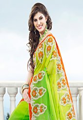Embroidered sarees are the best choice for a girl to enhance her feminine look. This shaded light green viscose georgette saree have beautiful embroidery patch work which is embellished with resham, stone and beads work. Fabulous designed embroidery gives you an ethnic look and increasing your beauty. Contrasting orange blouse is available. Slight Color variations are possible due to differing screen and photograph resolutions.